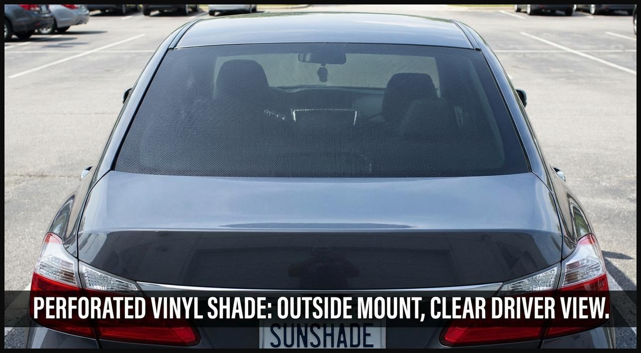A perforated vinyl sun shade applied to the exterior of a car's rear windshield, showing its subtle design and privacy.
