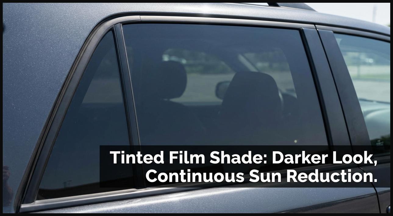 A window film style sun shade applied to a car window, giving it a darker, tinted appearance for continuous sun reduction.